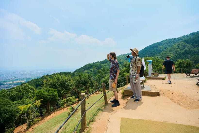 Kyoto: Arashiyama UNESCO Walking Tour with Admission - Crossing Togetsukyo Bridge