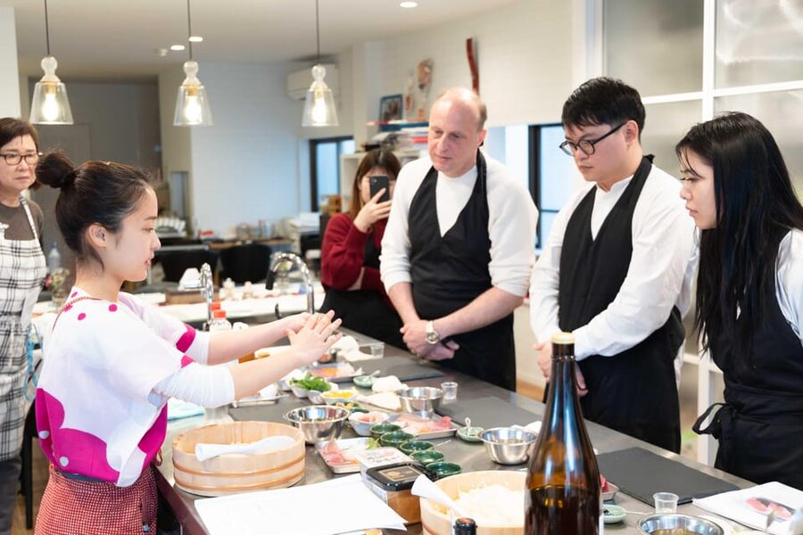 Kyoto: Enjoy Sushi & Market Tour! Best for Family & Couple! - Sitting down to eat what you made