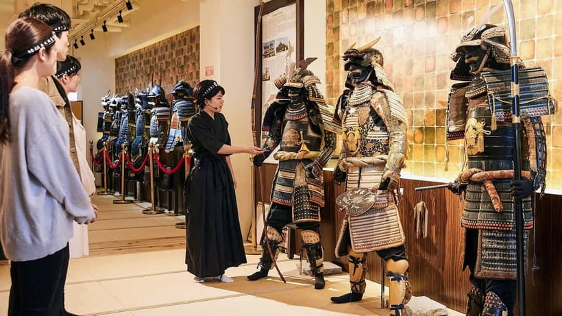 Kyoto : Family-Friendly Sword Lesson at Samurai Ninja Museum - Putting on the samurai outfit in Kyoto