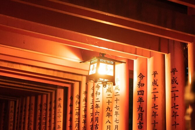 Kyoto Fushimi-Inari Night Walking Tour - Walking beneath the first rows of torii gates