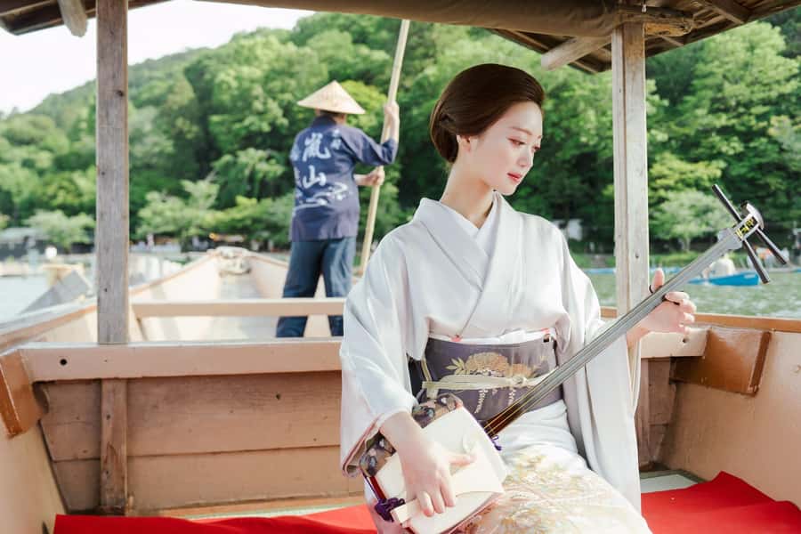 Kyoto: Private Boat Cruise with Shamisen and Games - Boarding the traditional yakatabune in Arashiyama