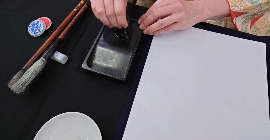 Kyoto: Sumi Ink and Brush Calligraphy Experience - Painting bamboo on a shikisi board