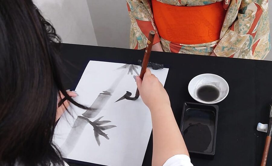 Kyoto: Sumi Ink and Brush Calligraphy Experience - Adding characters for bamboo and harmony