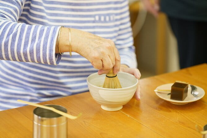 Matcha Grinding Experience and Walking Tour in Uji Kyoto - Grinding matcha at Fukujuen Ujicha Kobo